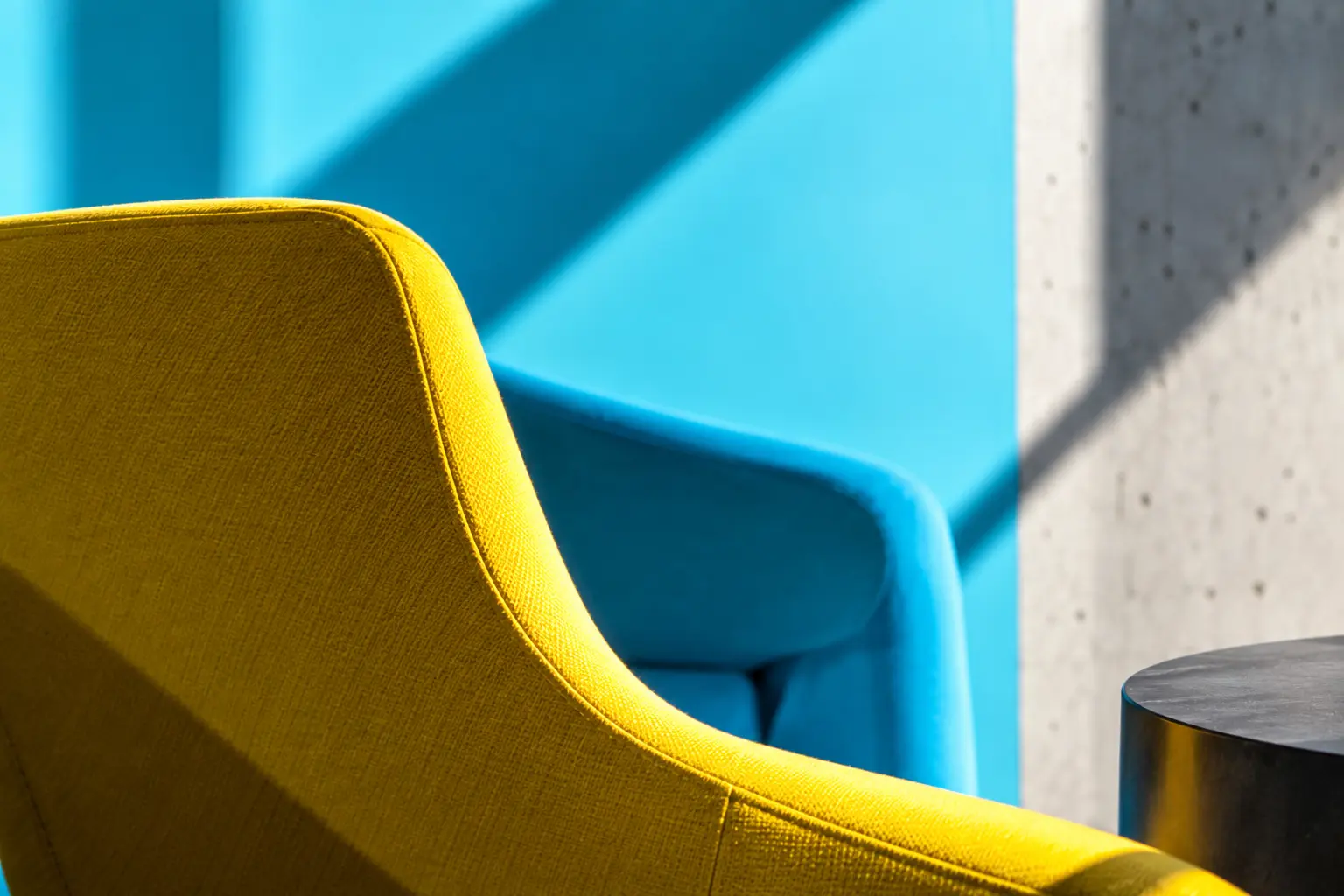 Yellow and blue chairs in a vivid architectural interior
